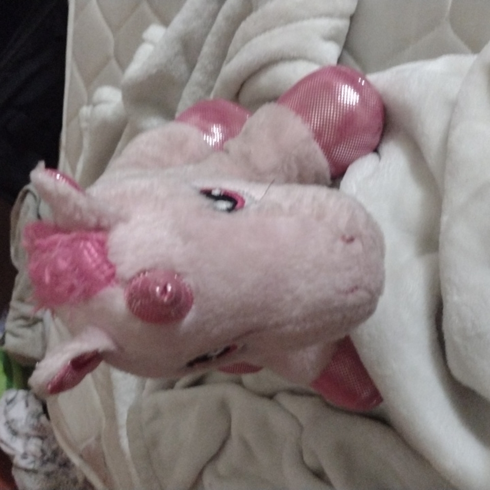 A stuffed animal unicorn